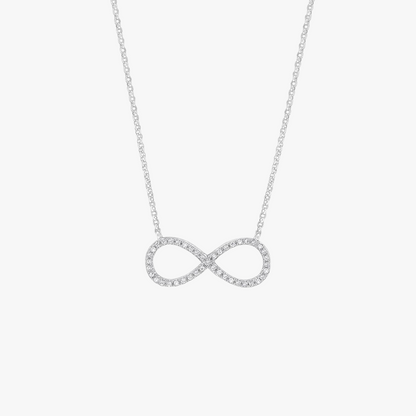 Silver infinity necklace on a light gray background